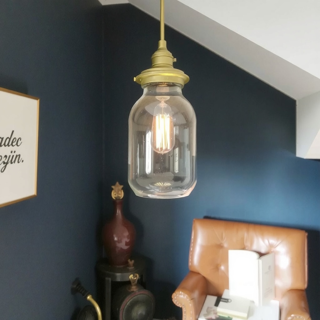 Warm brass pendant lights hanging in a dark corner of a bedroom