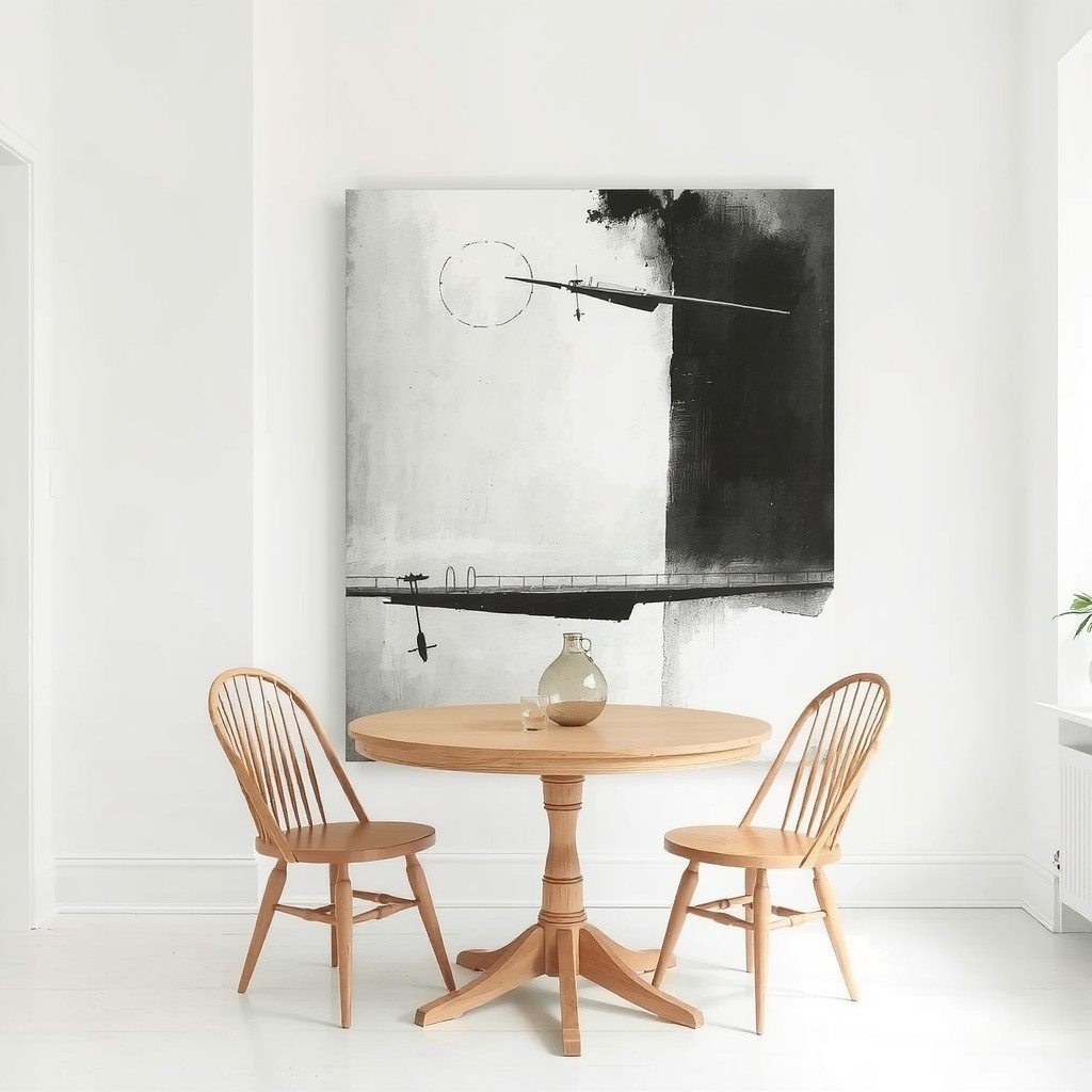 A dining nook featuring a round table and a single large piece of abstract monochromatic art on a white wall, acting as a strong anchor.
